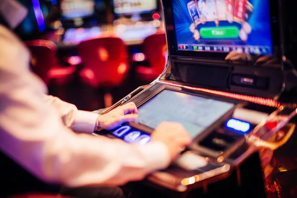 A young woman relaxing with her phone while dynamic casino elements float around her, illustrating the smooth mobile experience offered by the JLMMM app.