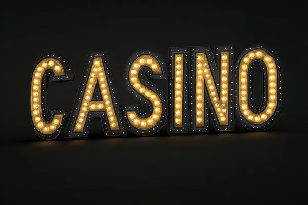 A professional dealer in a tuxedo greeting players at the roulette table, symbolizing the authentic live casino feel at JLMMM.